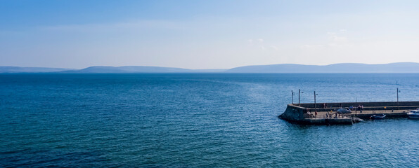 Obraz premium Aerial shot of Barna pier on a sunny day, Galway