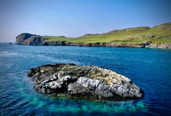 Flock of birds on sunbathing on a rock on the coast of Inishbofin, in the summertime. Connemara, Galway, Ireland