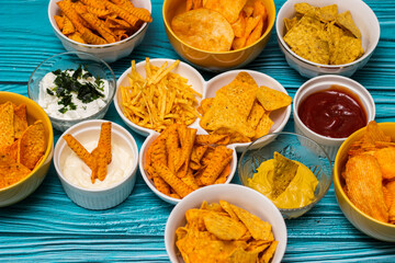 Salty snacks assortment and dipping sauce