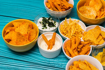 Salty snacks assortment and dipping sauce
