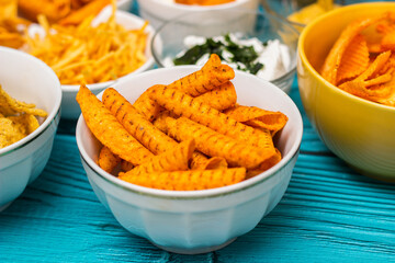 Salty snacks assortment and dipping sauce