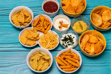 Salty snacks assortment and dipping sauce