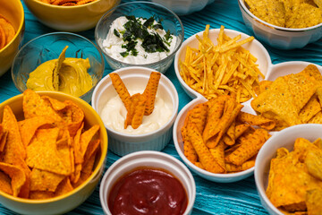 Salty snacks assortment and dipping sauce