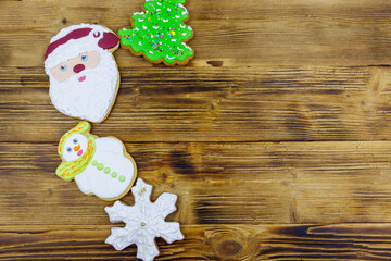 Christmas gingerbread cookies on a wooden table. Top view, copy space