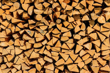 Background of the stacked dry chopped firewood