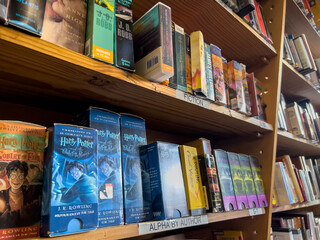 Fototapeta premium Redmond, WA USA - circa November 2022: Close up view of used audiobooks for sale inside a Half Price Books.