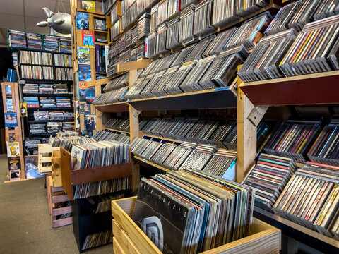 Kirkland, WA USA - circa November 2022: Selective focus on used vinyl and cds for sale inside Vortex Music and Movies store.