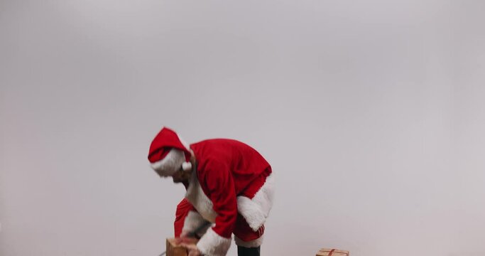 Wasted, blindfolded and shirtless Terrible Santa Jake plays golf with your Christmas presents.