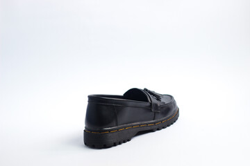 A pair of leather elegant shoes on a white background. Selective focus shoes