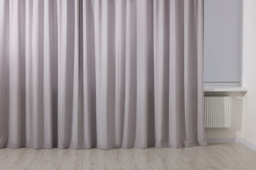 Light grey window curtains in living room