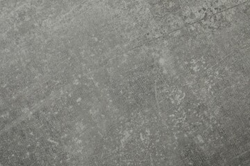 Texture of light grey stone surface as background, closeup