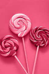 heart shaped lollipop on a pink background