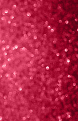 Festive background with bokeh in trendy color of the year viva magenta