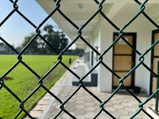 Closeup view of football chain link fence.