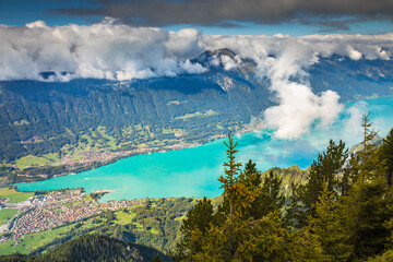Aerial view of Swiss Alps and Lake Brienz at dramatic sunset, Interlaken