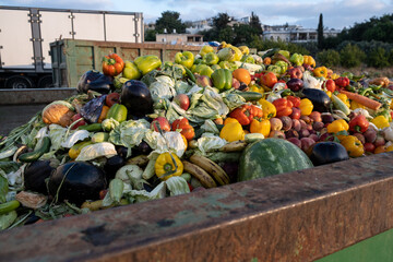 Bio Waste of Expired Vegetables in a huge container, Organic mix in a rubbish bin. Heap of Compost...