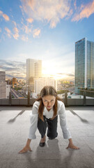 Asian businesswoman in start position ready to run