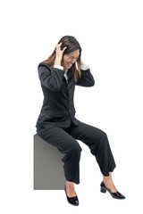 Asian businesswoman sitting with frustrated expression