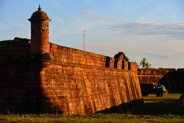 Sunset on the Real Forte Príncipe da Beira fort ruins and a military truck, near the town of Costa...