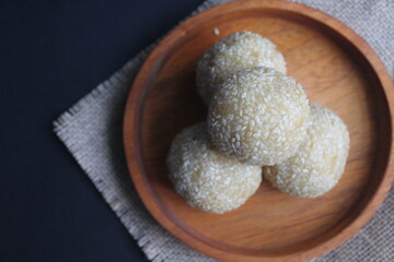 Onde-onde is a traditional Indonesian snack that is round in shape sprinkled with sesame seeds and filled with peeled green beans