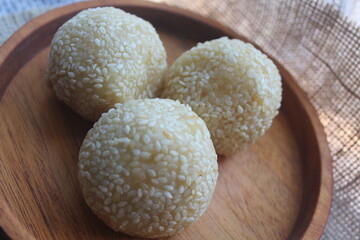 Onde-onde is a traditional Indonesian snack that is round in shape sprinkled with sesame seeds and filled with peeled green beans