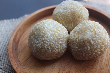 Onde-onde is a traditional Indonesian snack that is round in shape sprinkled with sesame seeds and filled with peeled green beans