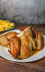 Grilled chicken with French fries and tomato, radish and lettuce salad
