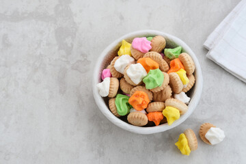 Gemrose or button cookies topped with colorful icing sugar. Indonesian traditional biscuits
