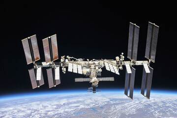 International space station orbiting the planet Earth. ISS. Dark background, soft stars. Digitally...