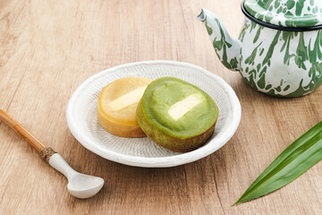 Kue Lumpur or Mud Cake, Indonesian traditional snack made from potatoes, flour, egg, and coconut milk topped with cheese