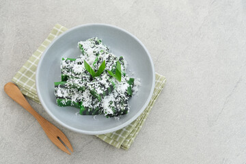 Kue Jongkong layer cake with grated coconut, Indonesian traditional snack
