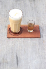 a glass of ice cappucino with sugar in the morning