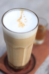 a glass of ice cappucino with sugar in the morning