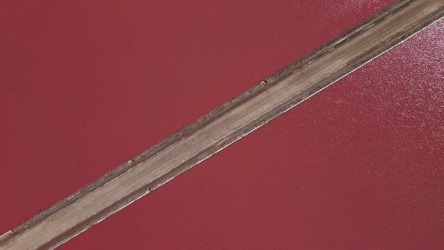 Aerial shot revealing a picturesque, hilly scenery around Lake Grassmere Saltworks