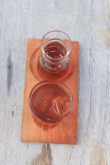 a glass of black coffe made using japanese technique and ice cubes in the morning
