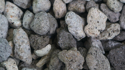 Detailed surface texture of a pile of pumice as a background