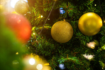 Obraz na płótnie Canvas Merry x-mas,Close up of Colorful balls ,gifts box and Christmas greeting picture parcel decoration on Green Christmas tree background Decoration During Christmas and New Year.