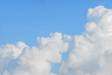 Very large cumulus clouds with a blue sky.
