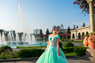 Beautiful young woman dressed in a princess costume in a landscape of pools of water and blue sky.