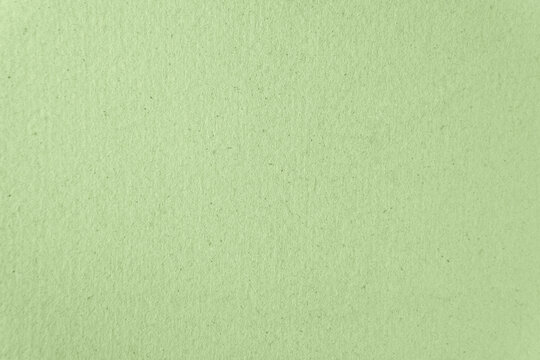 Recycled green color paint on cardboard box blank paper texture background