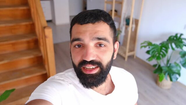 happy man having video call at home interior, talking with his audience. technology, people and lifestyle concept