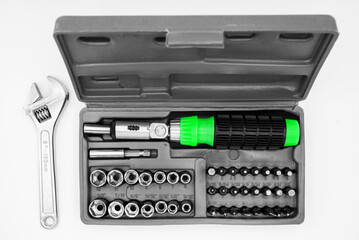Fototapeta premium small set of tools in a case with a screwdriver with removable bits and a ratchet wrench