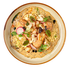 Portion of gourmet ptitim dish with seafood and herbs