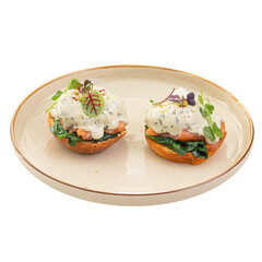 Portion of benedikt egg with dor-blue sauce
