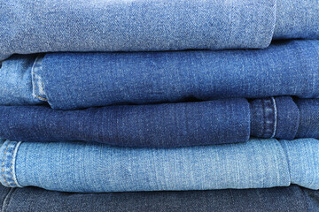 close up of worn blue jeans cloth fabric