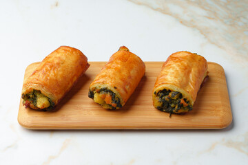 Banquet table with variety of stuffed pies pastry