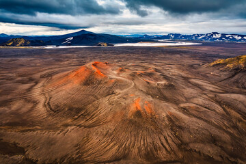 Red volcano crater with moody sky in central of highlands on summer at Iceland