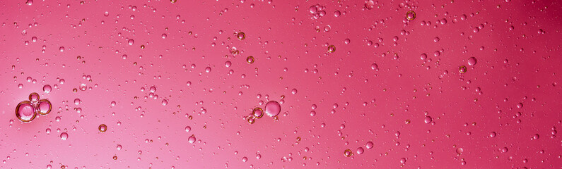 oil with bubbles on Trendy color of 2023 viva magenta. background. Abstract space background. Soft selective focus. macro of oil drops on water surface. copy space. air bubbles in water