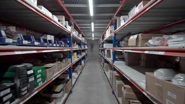 large factory warehouse. The camera pans between shelves inside a large store.
