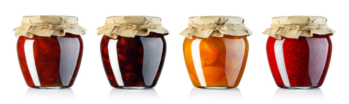set of fruits jam in glass jars covered with wrapping paper isolated on white